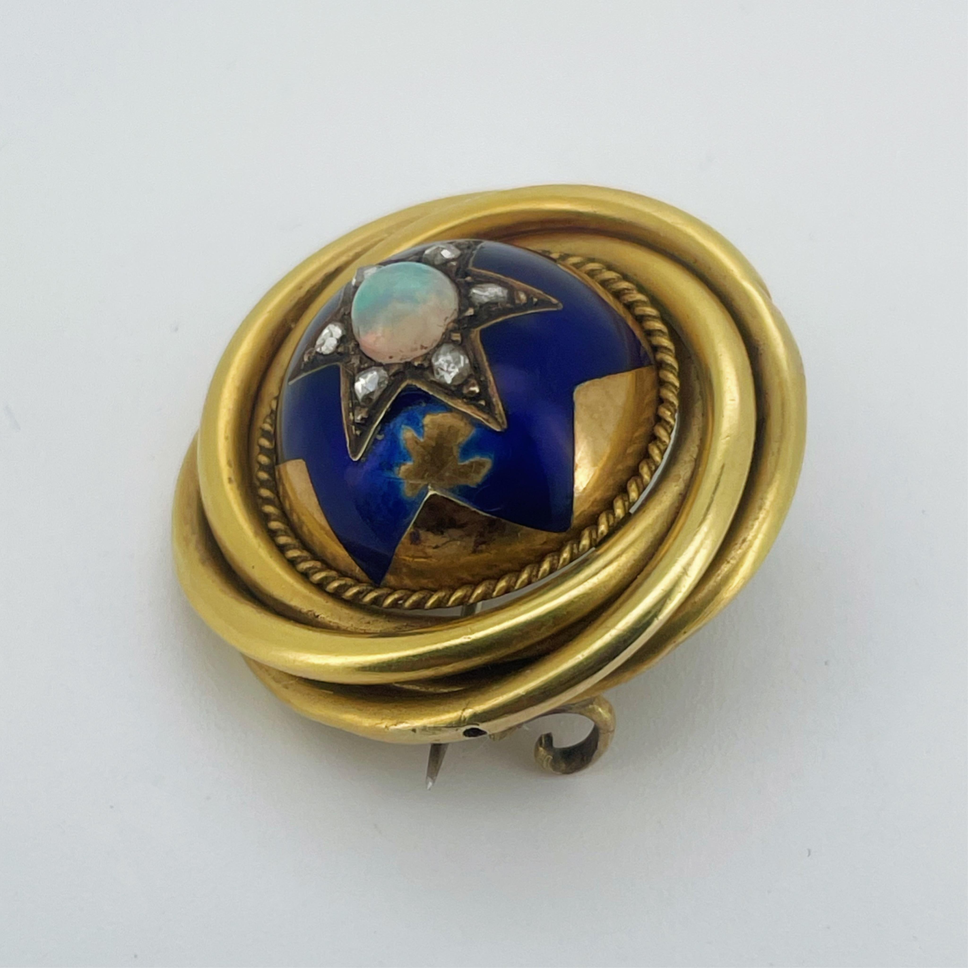 A Victorian gold, enamel, opal and diamond brooch, mid 19th century, of circular outline, the domed centre set with a cabochon opal surrounded by rose-cut diamonds, within a six-rayed star motif in blue enamel, to a bord